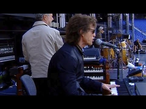 Thumbnail for Rolling Stone, Mick Jagger Plays Piano & Sings Backstage While Charlie Watts & The Stones Join in by Rolling Stones